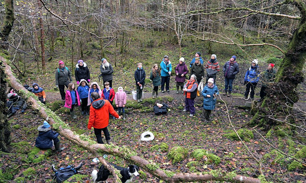 Assynt Community Trust volunteers gather in the forest in an event to protect the elms.