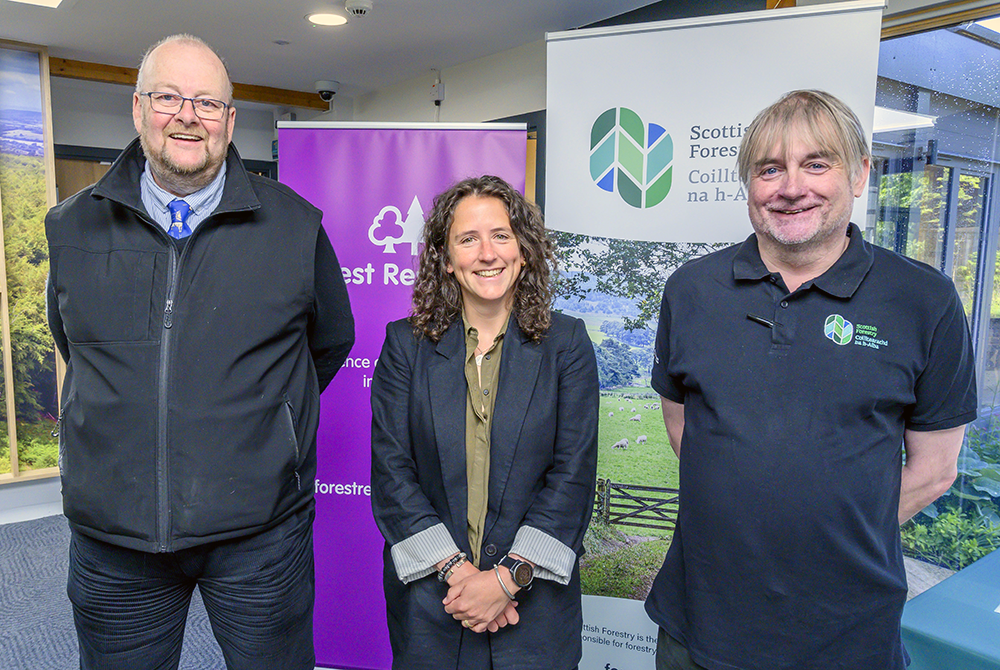 At a Scottish Forestry stakeholder event, Rural Affairs Secretary Mairi Gougeon stands with the CEO of Forest Research, James Pendlebury, and the CEO of Scottish Forestry, Paul Lowe.